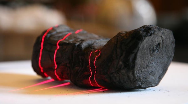 Charred scrolls from Herculaneum with red laser light