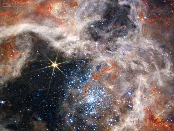 A group of stars at NGC 2070's center, known as R136, in near-infrared light just a bit too red for humans to see.