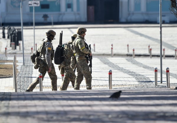 Soldiers patrol city streets