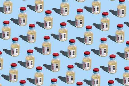 Repeated vials with covid-19 vaccine on a blue background