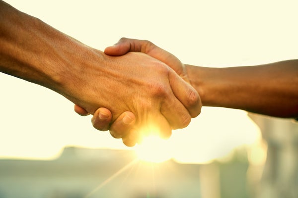 Closeup of two people shaking hands