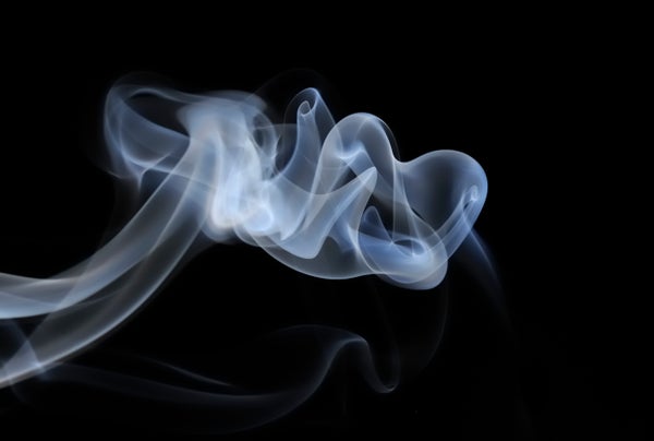 Smoke against a black background.