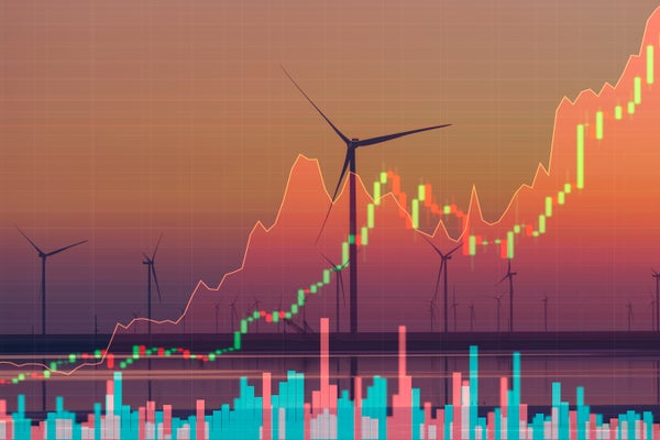 Wind turbines on the background of stock charts