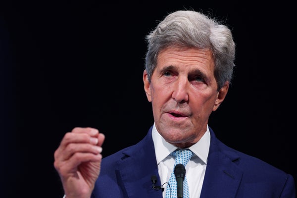 John Kerry gestures while giving speech.