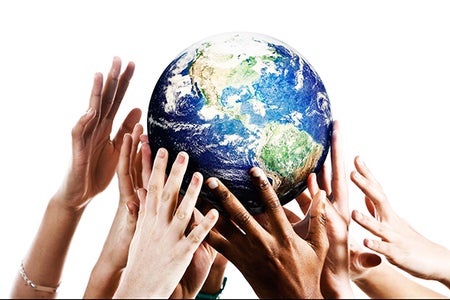 people reaching for a globe