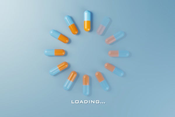 Digital loading symbol with medicine pills, flat lay