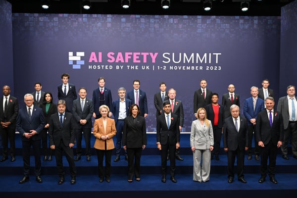 Attendees, including U.S. vice president Kamala Harris and British prime minister Rishi Sunak, among other governmental and private-interest officials, line up to pose for a photograph