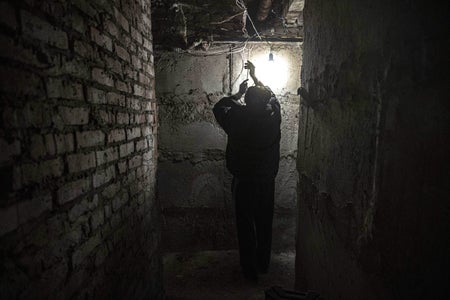 A civilian tries to draw electricity in a basement