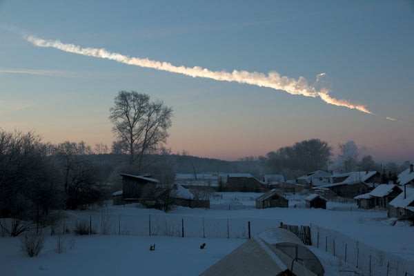 A rural landscape shown with a white cloud like streak across the sky which is identifies as the Chelyabinsk Meteor Trail.