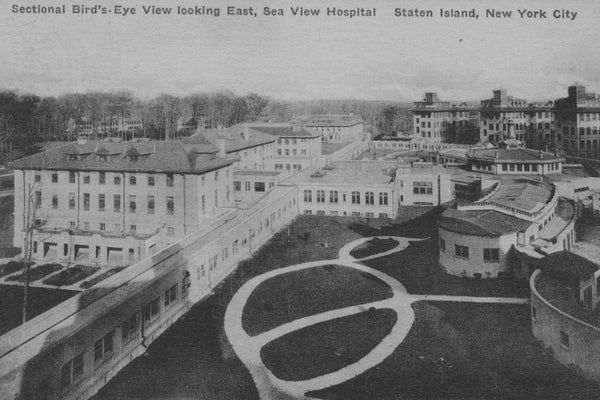 Archival black and white photo showing hospital grounds