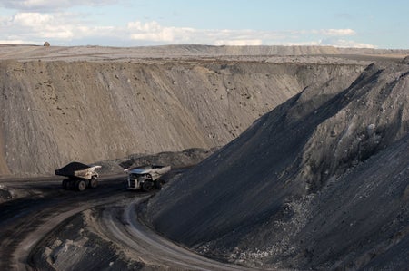 Two trucks in a coal mine