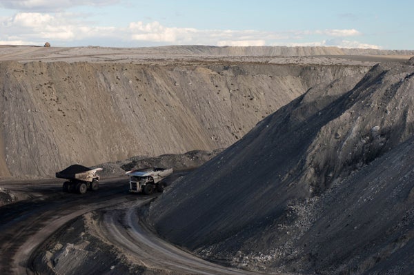 Two trucks in a coal mine