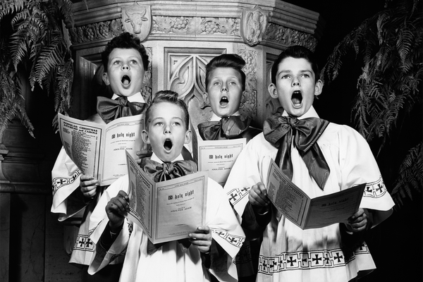 1940s portrait of 4 choirboys singing "O Holy Night"