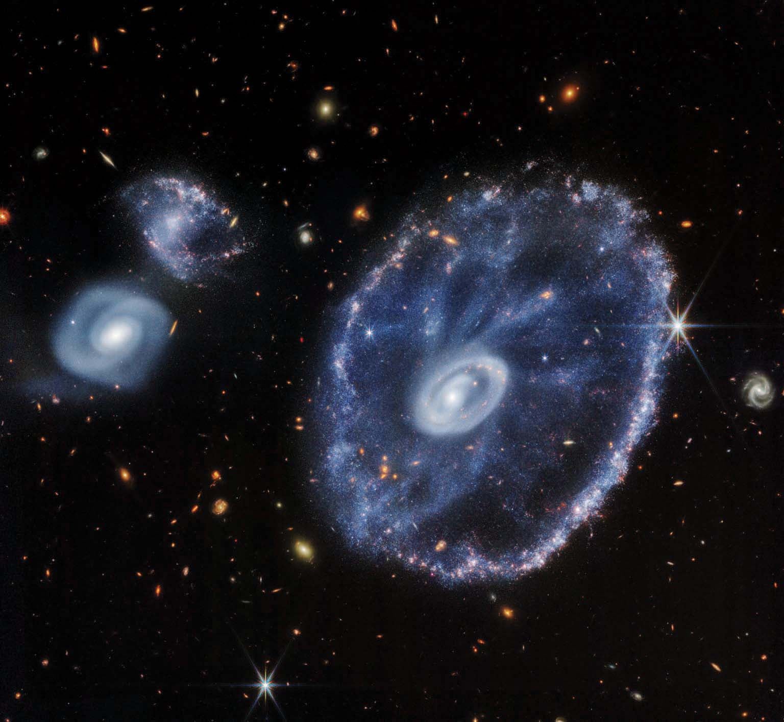 The Cartwheel Galaxy displays its characteristic dust-rich “spokes” and starry inner and outer rings in this near-infrared view from JWST.