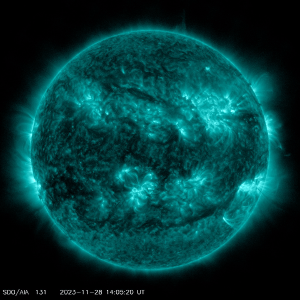 The sun (green on black background) as seen by NASA's Solar Dynamics Observatory spacecraft in late November 2023, including a large solar flare emitted from the southern half of the sun.