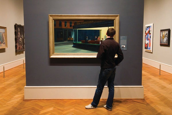 A person looking at art in a museum.