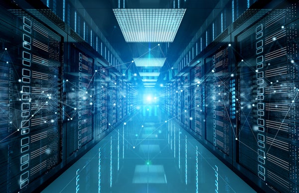 Two banks of futuristic supercomputers face each other in a glow of blue light.