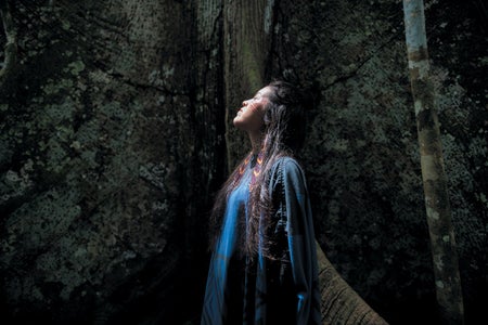 Ashaninka woman by a sacred kapok tree.