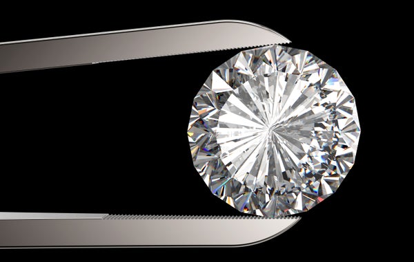 Diamond in tweezers.
