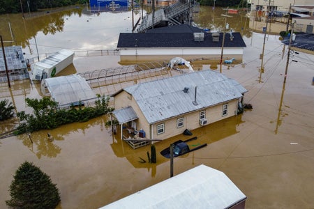 Aerial view of homes submerged under flood waters