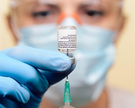 Close-Up of the BioNTech–Pfizer vaccine against COVID-19 being prepared to vaccinate a patient.