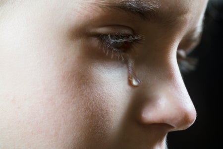 Close-up of a girl shedding a tear