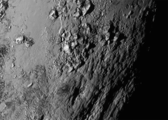 New Close-Ups of Pluto and Charon Present Puzzle for Scientists