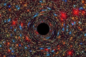 Artist's impression of a black hole against a rich background of stars
