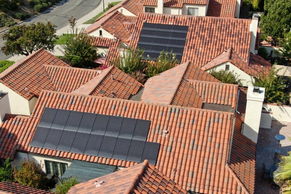 Aerial top view of residential villas with solar panel on the roof