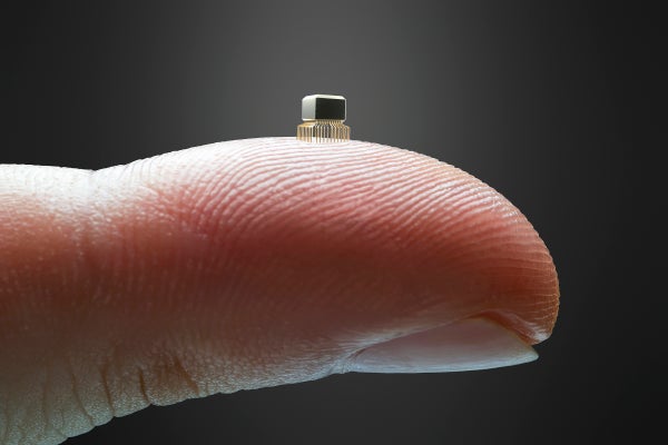 Microchip on a fingertip.