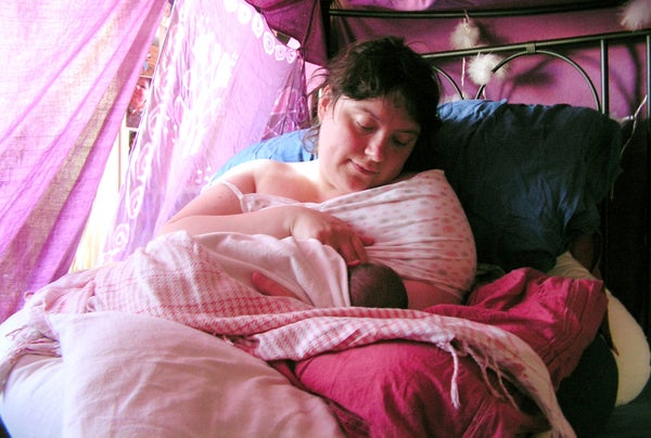woman with newborn at home