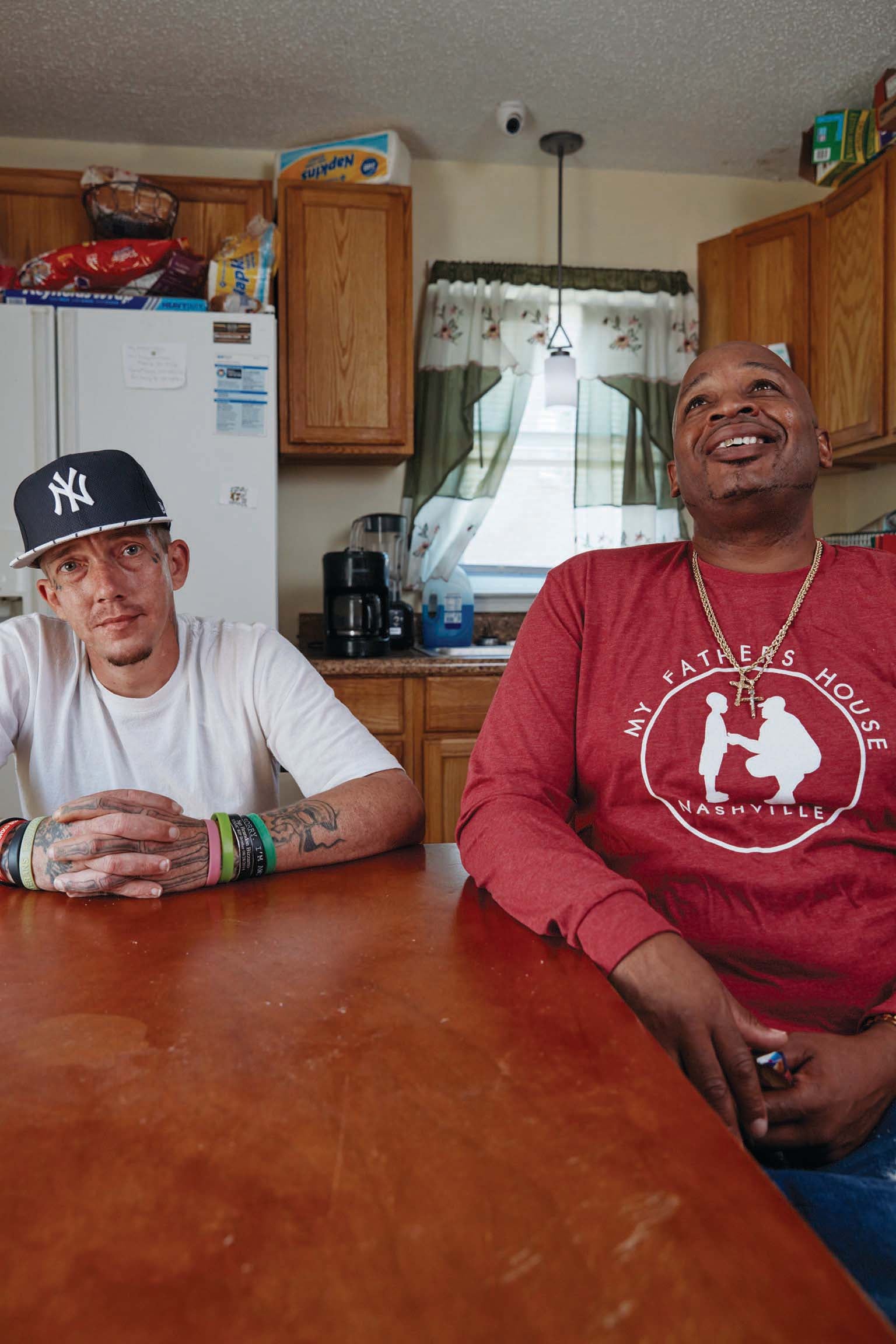 Gooch and Charles Gordon sitting in a kitchen.