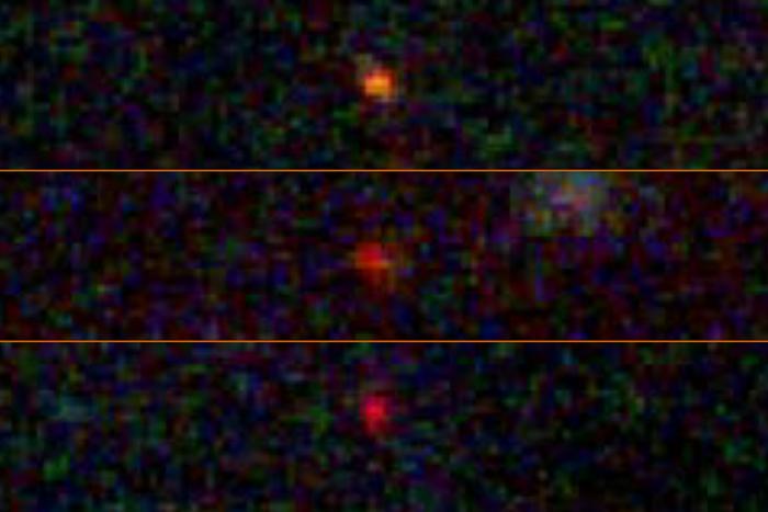 A stack of three images, presenting as orange and red pixelated orbs