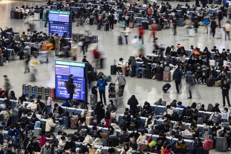 Travelers at Shanghai Hongqiao Railway Station in Shanghai