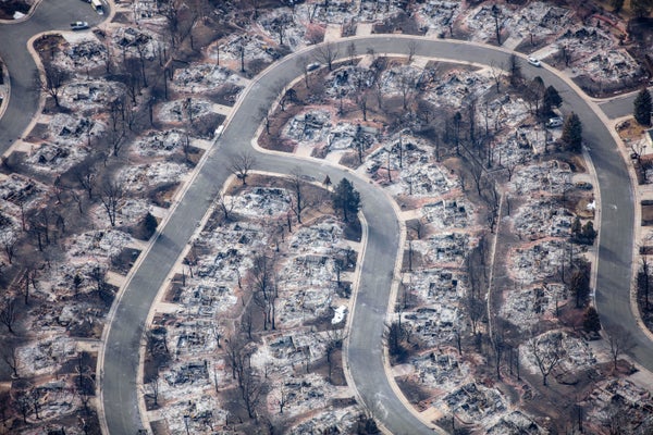 Aerial view of neighborhood burned by wildfire burned
