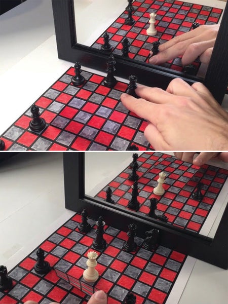 Black chess pieces move across a hand-drawn red-and-gray chess- board.