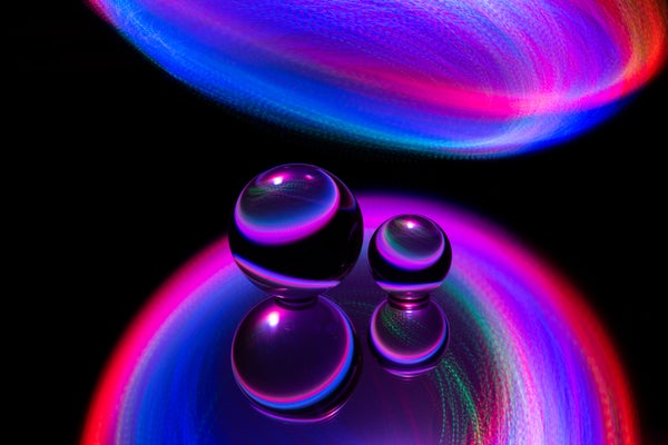Glass spheres under neon lights.