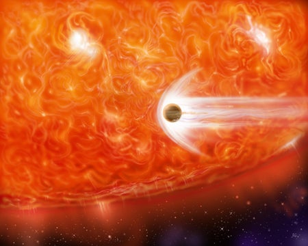 An artist's impression of red giant star engulfing an accompanying planet.