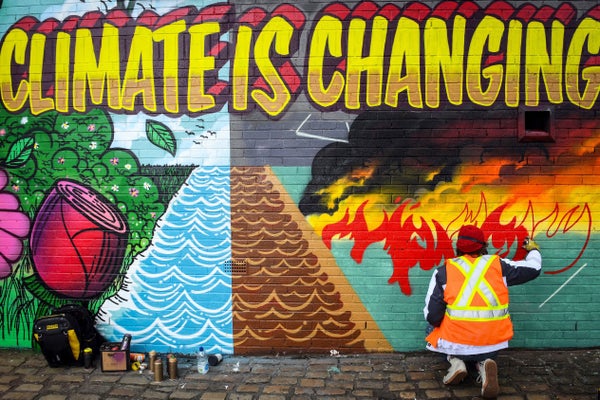 Artist paints colorful mural on Climate Change
