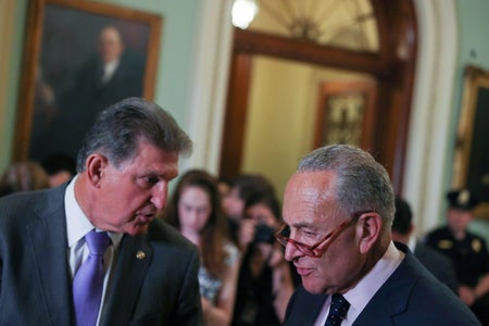 Chuck Schumer and Senator Joe Manchin in conversation