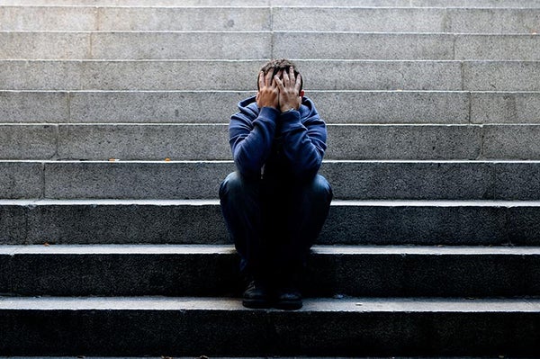 man sitting on stairs