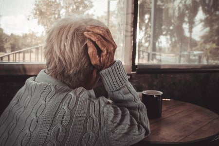 Senior person sitting at table