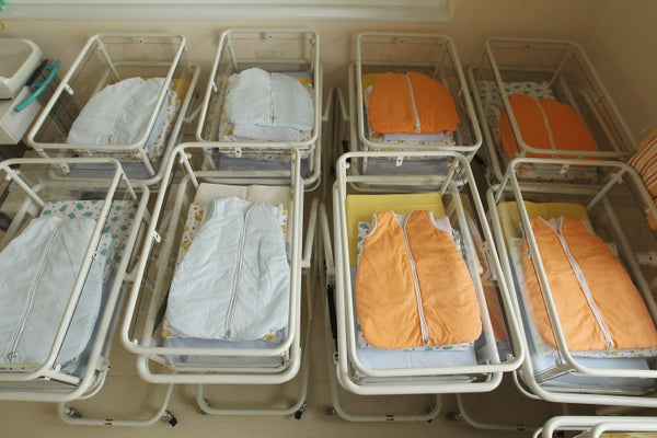 Empty baby beds in a maternity ward.