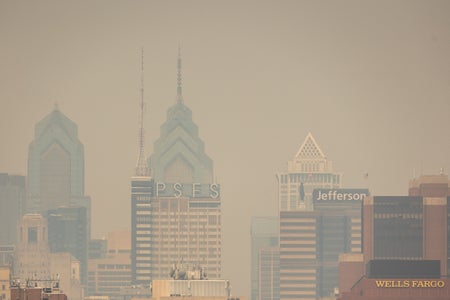 City skyline obscured by wildfire smoke