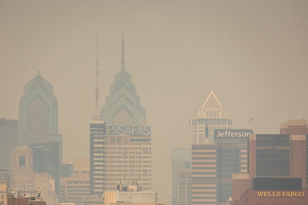 City skyline obscured by wildfire smoke