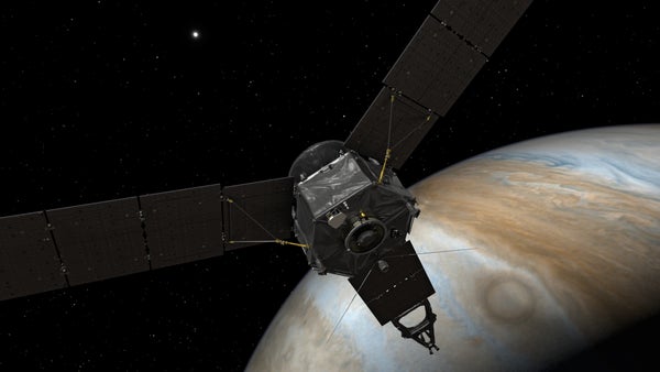 An illustration of the Juno spacecraft at Jupiter