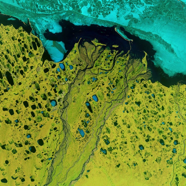 Colorful blue-and-green satellite image of Prudhoe Bay, Alaska