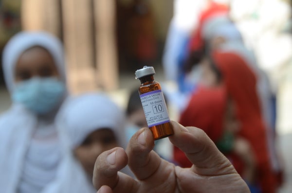 Hand holding measles and rubella vaccine in Peshawar, Pakistan on November 17, 2021.