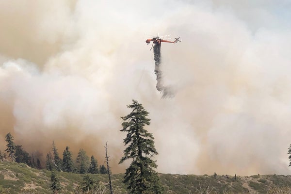 A helicopter midflight during wildfire.