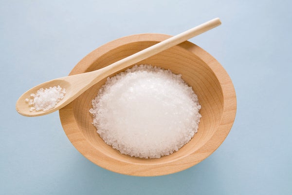 Salt in wooden bowl with spoon